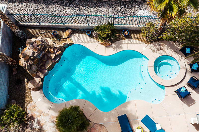 Aerial view of a residential pool remodel and pool deck
