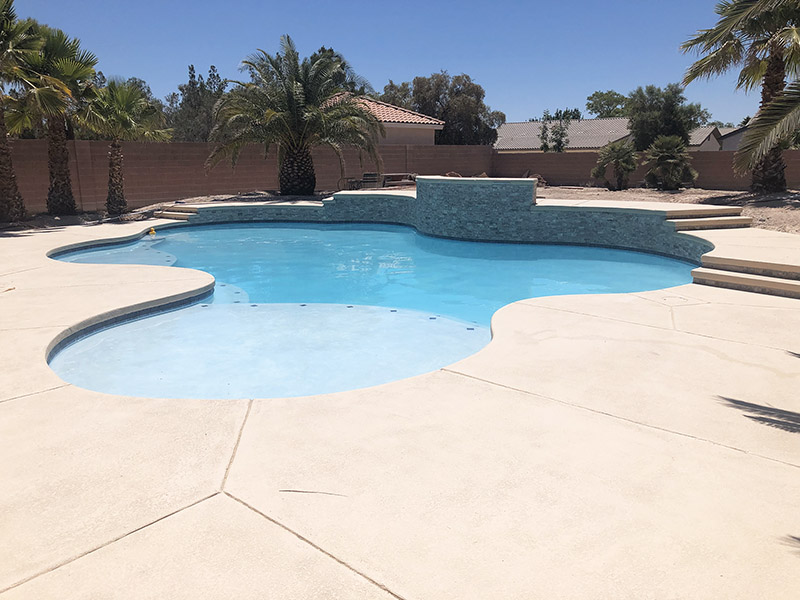 A residential pool in Las Vegas with a patio / pool deck in the foreground - Residential Pool Repair.